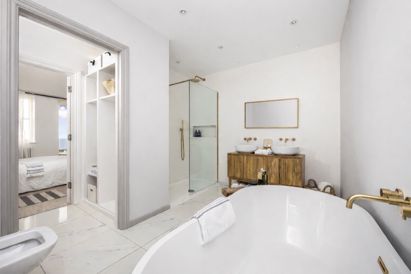 Bathroom suite with freestanding bath, twin basins and walk-in shower at The Lookout Brighton