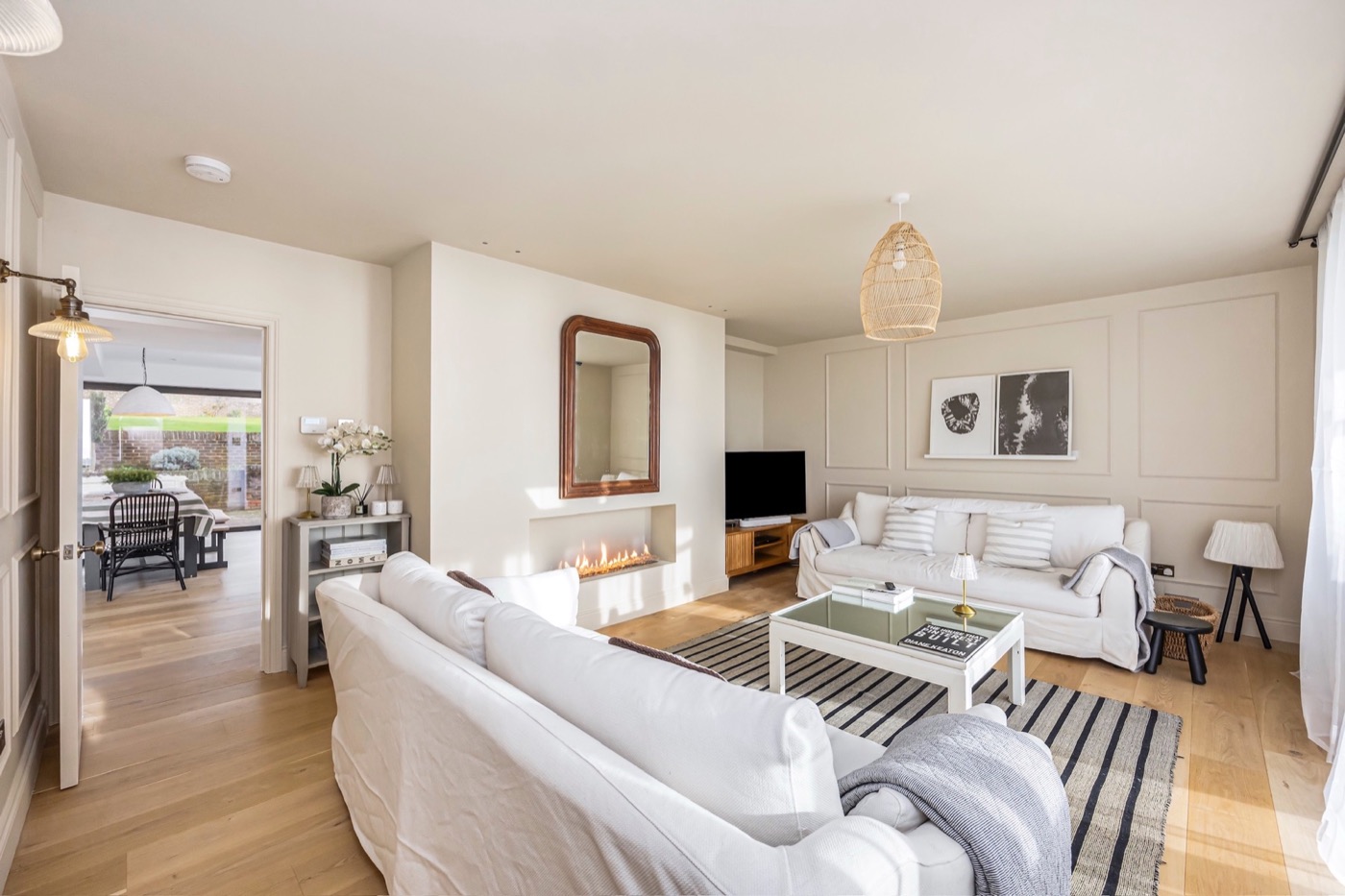 Light-filled living room with fireplace at The Lookout Brighton
