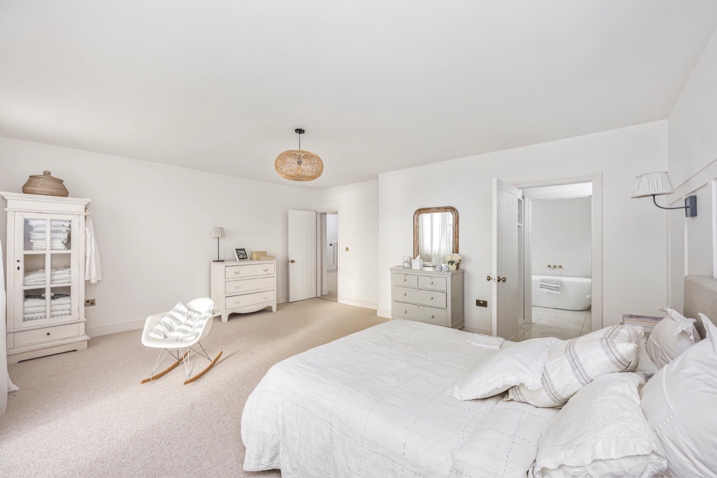 Principal bedroom suite with seating area and en-suite bathroom at The Lookout Brighton
